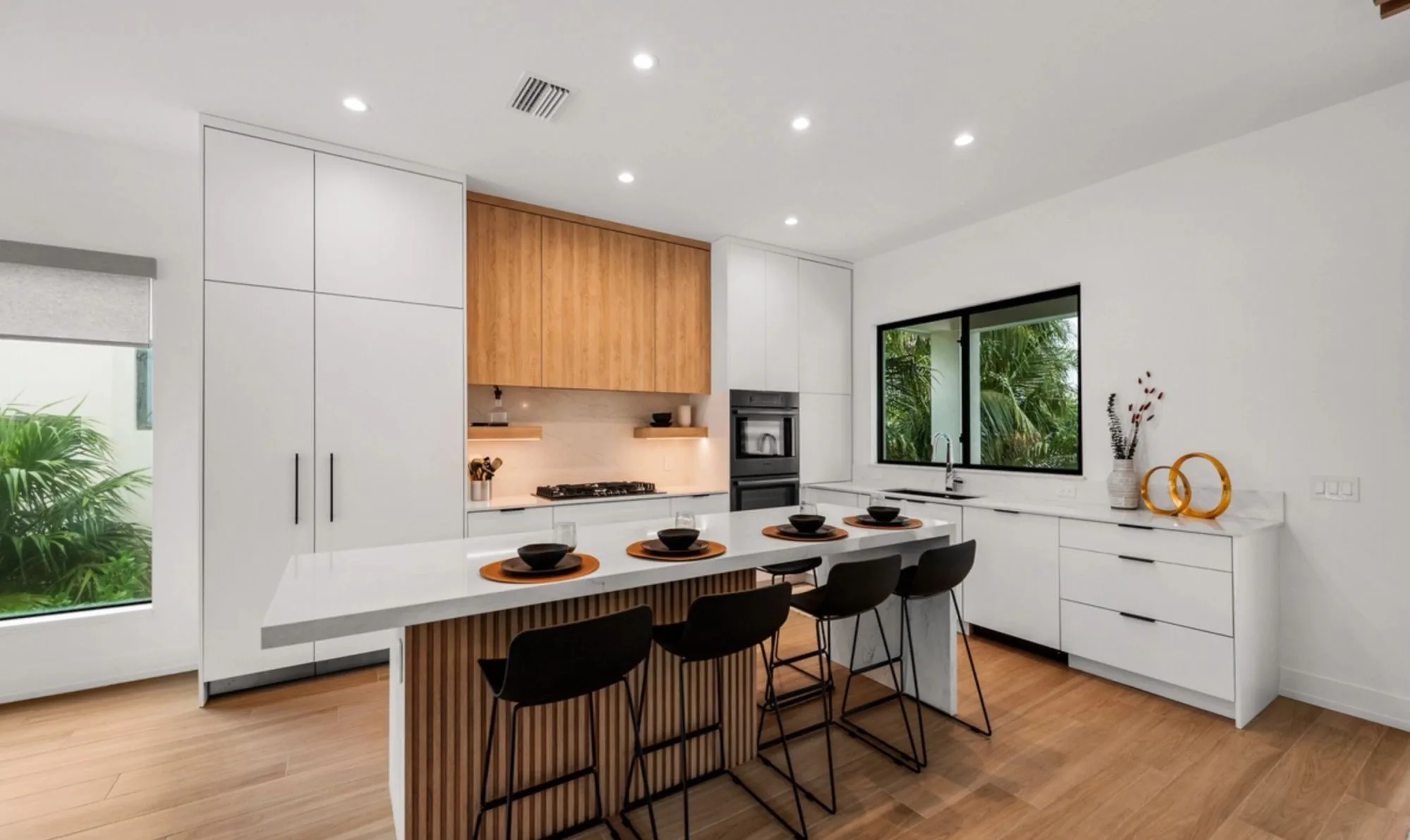 The fluted oak island base and full height pantry wall
