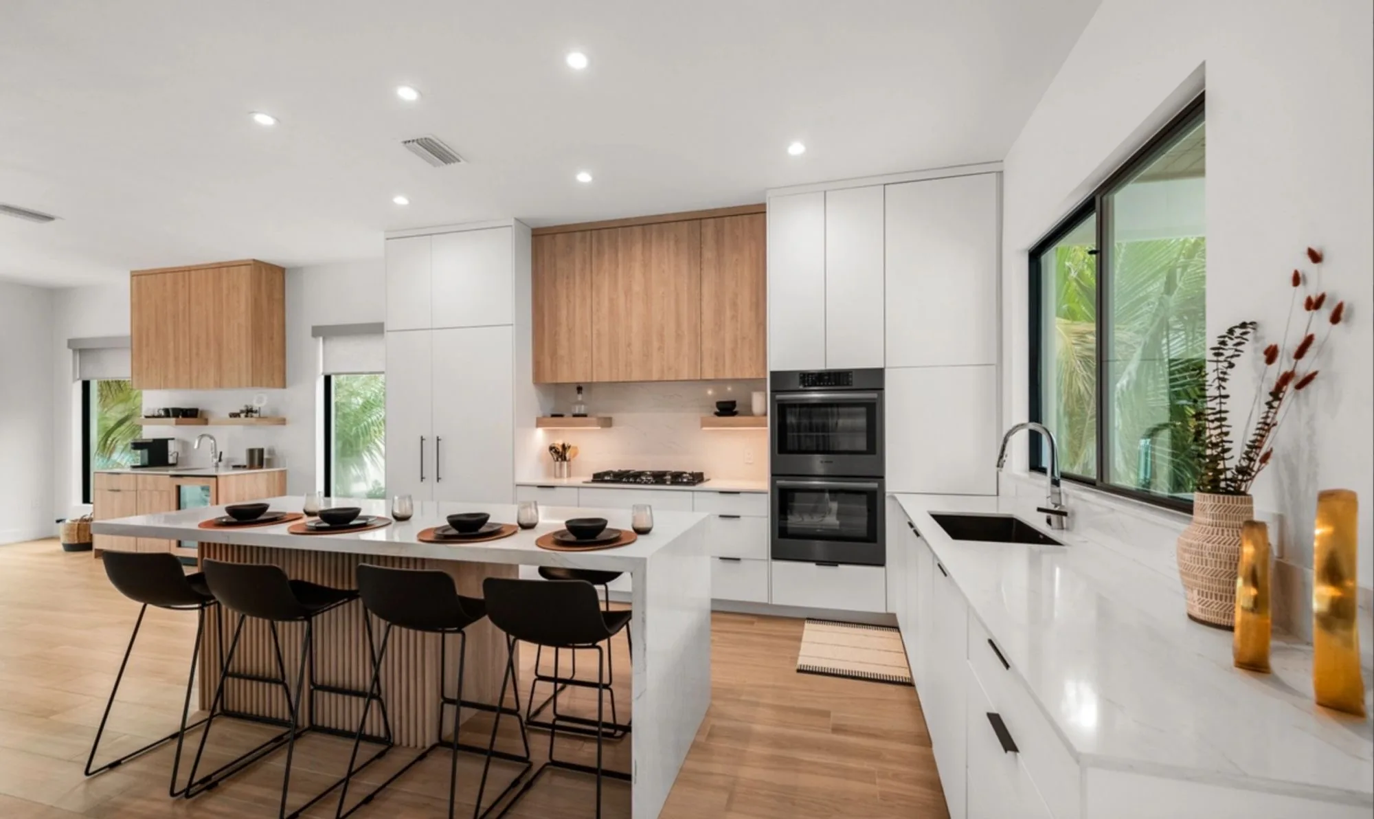 A custom white and oak kitchen built by Sarasota Cabinets and Design